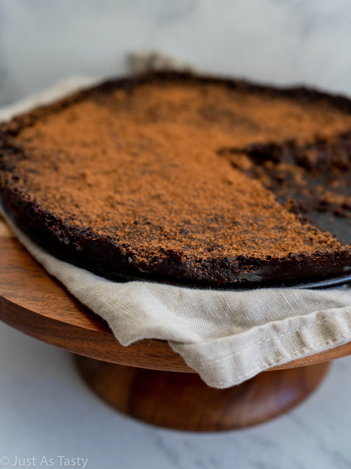 Close-up of flourless chocolate cake that has been cut into.