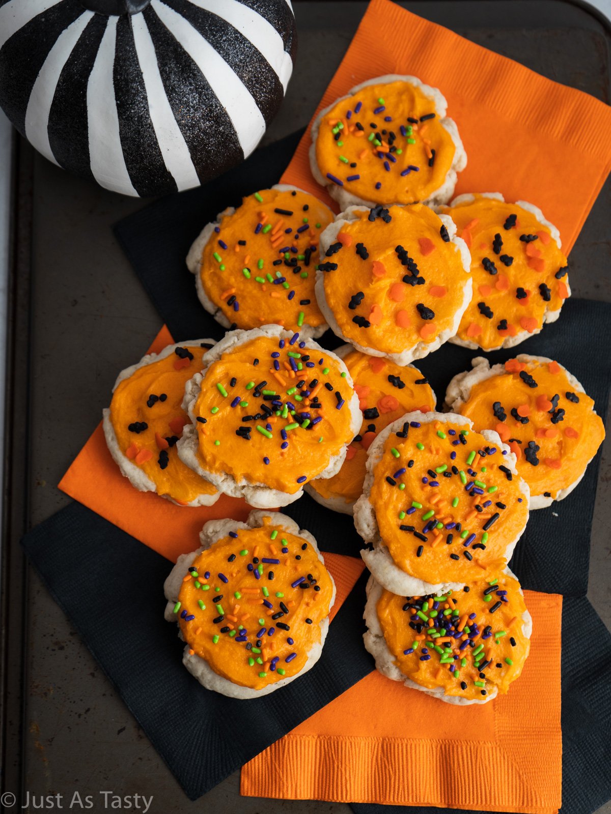 Orange frosted sugar cookies topped with Halloween sprinkles.