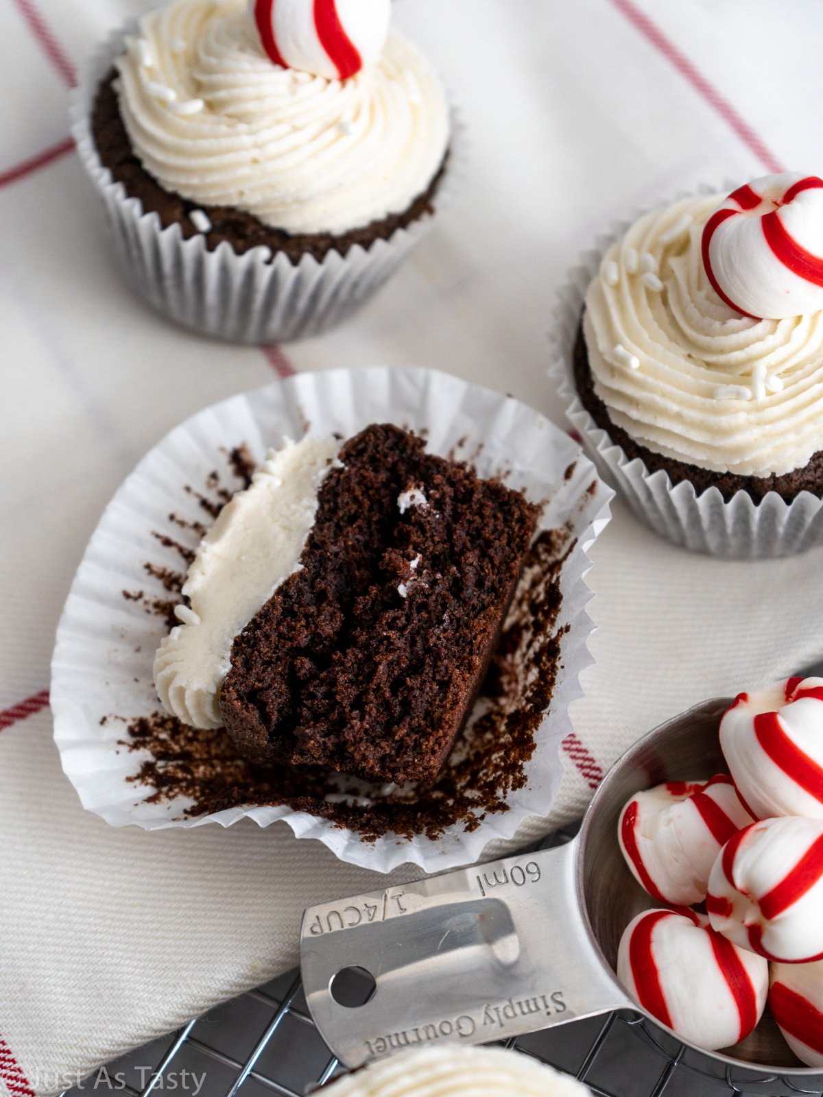 Close-up of a frosted chocolate cupcake cut in half. 