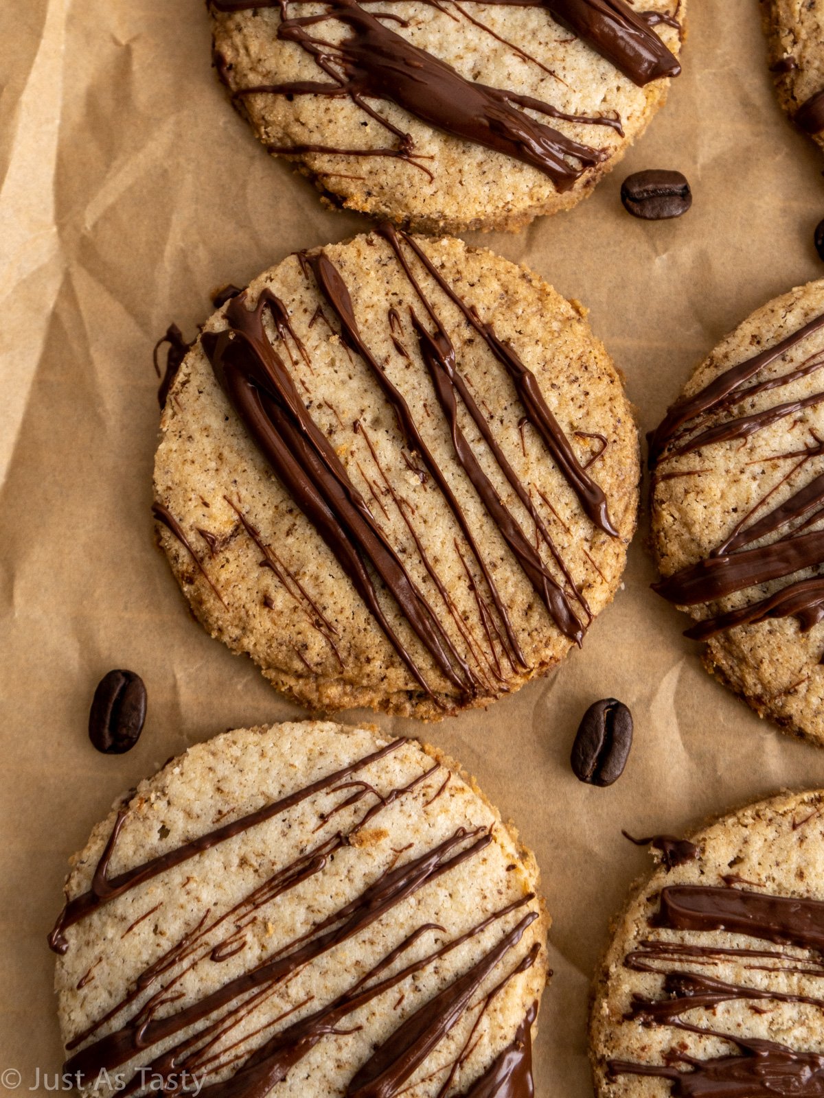Espresso shortbread cookies on brown parchment paper.