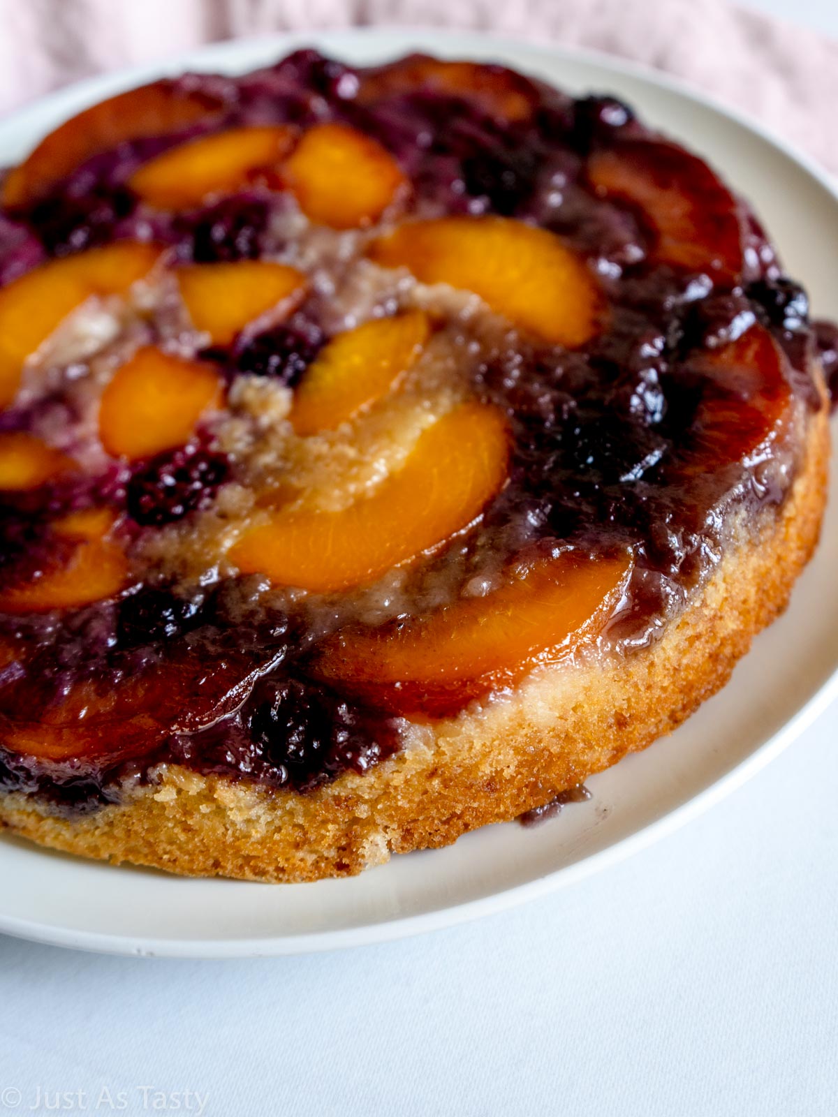 Close-up of peach upside down cake.