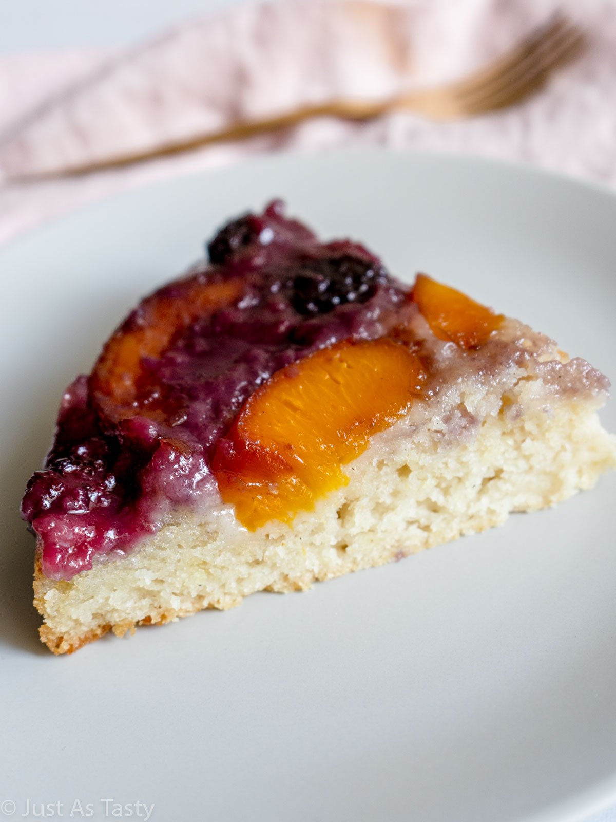 Slice of peach upside down cake.