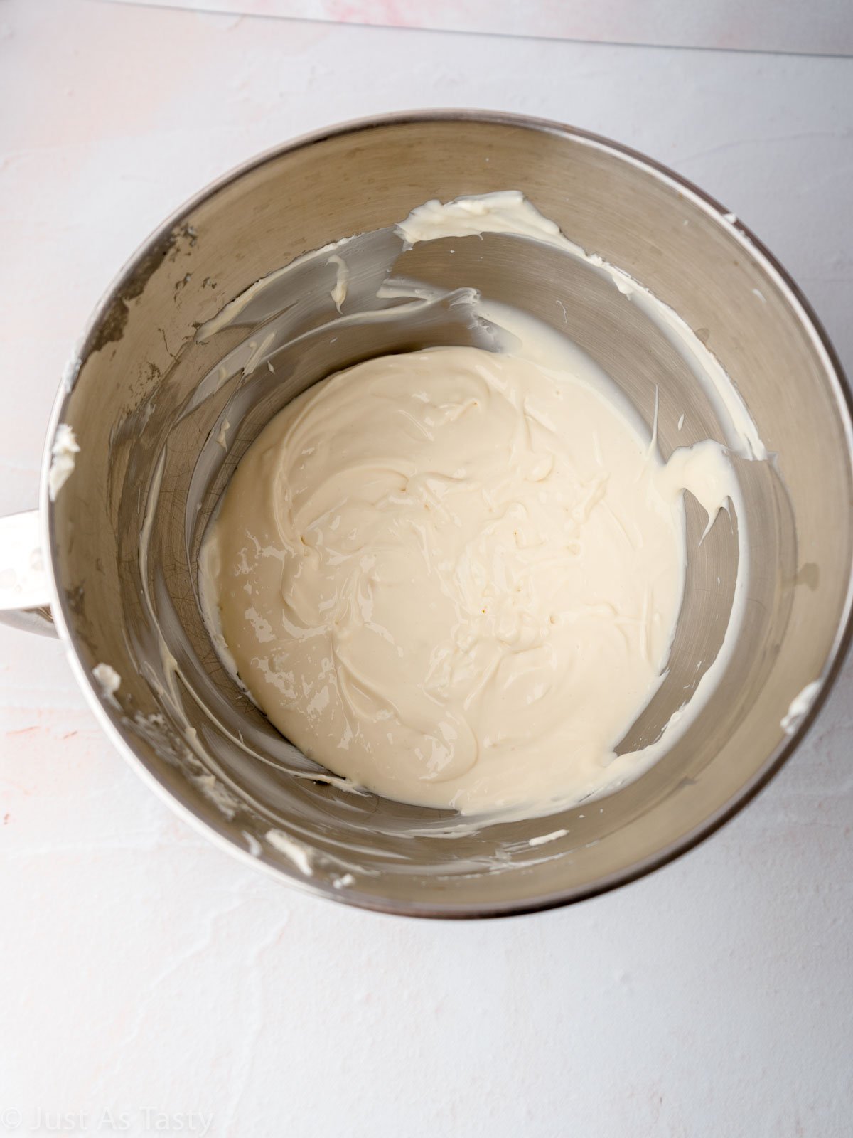 Cheesecake filling in a mixing bowl.
