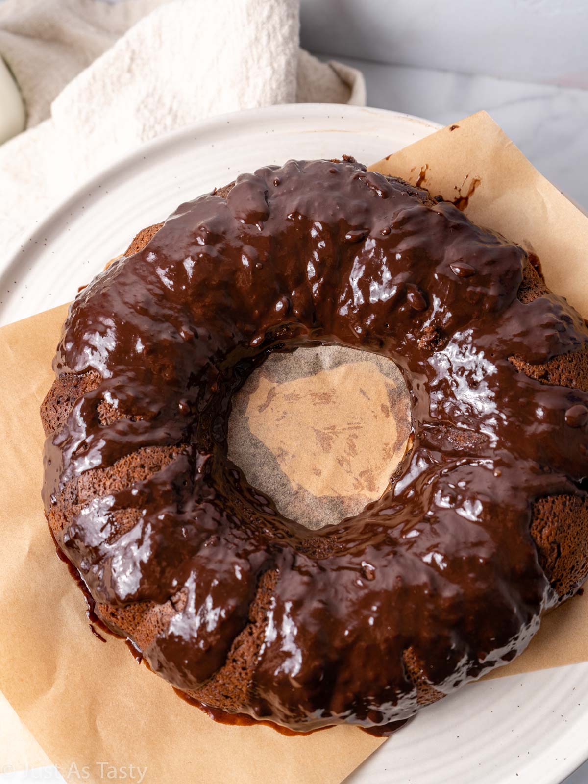 Gluten free chocolate bundt cake topped with chocolate ganache.