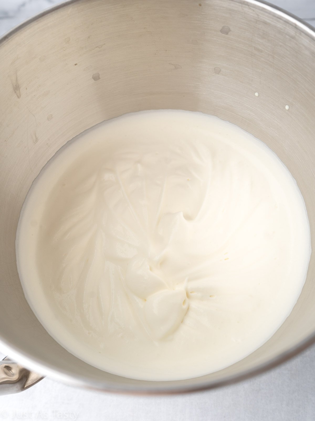 Whipped cream in a mixing bowl.