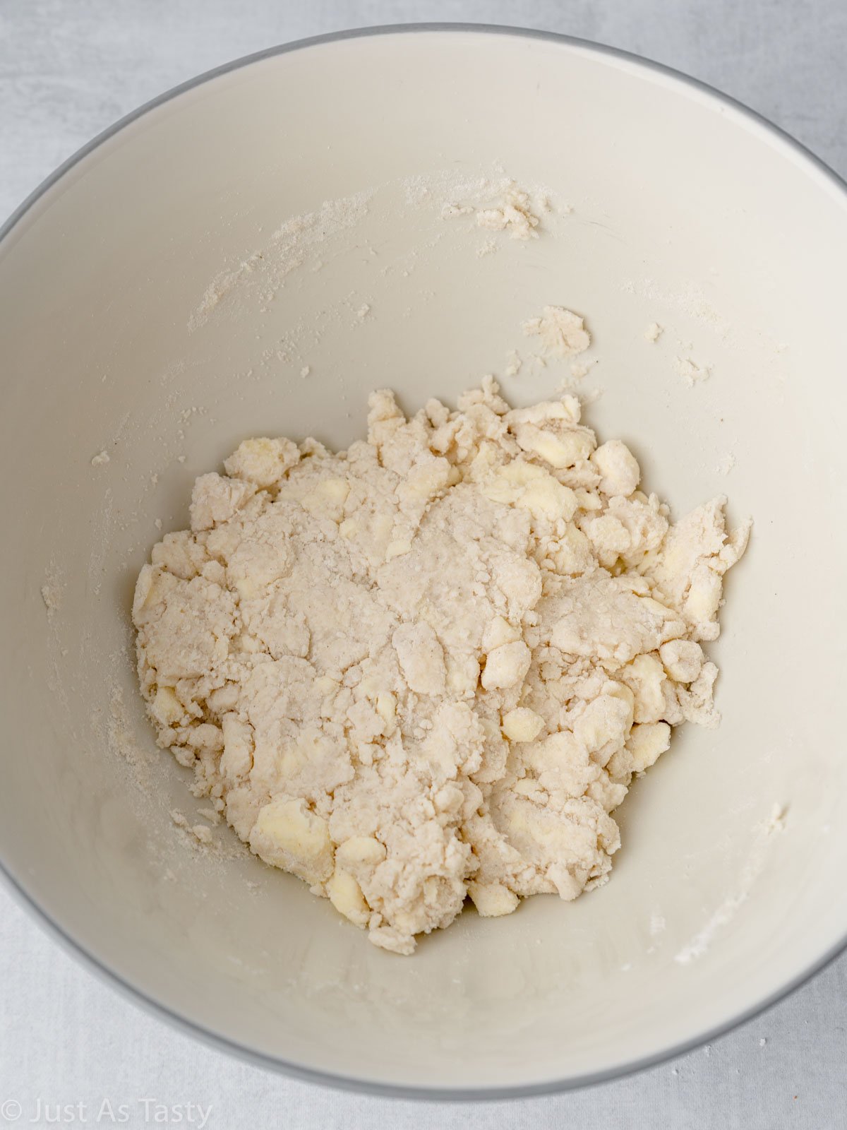 Pie crust dough in a mixing bowl.
