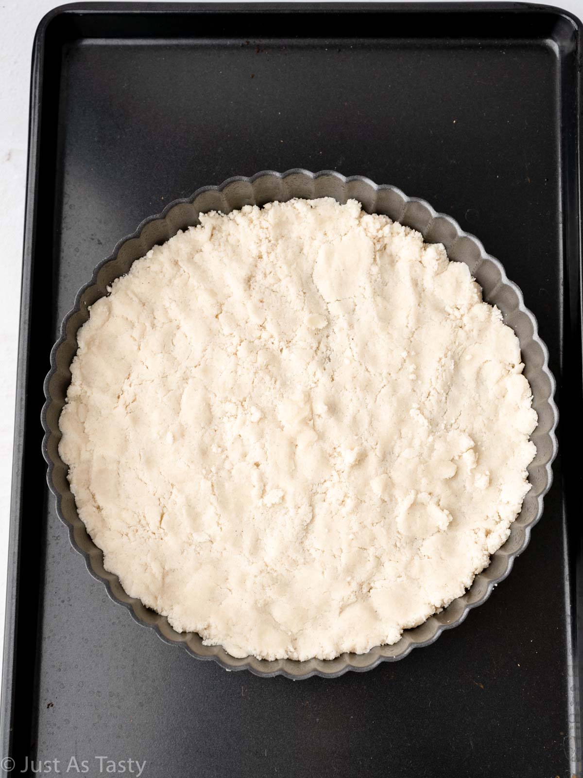 Shortbread crust in tart pan.
