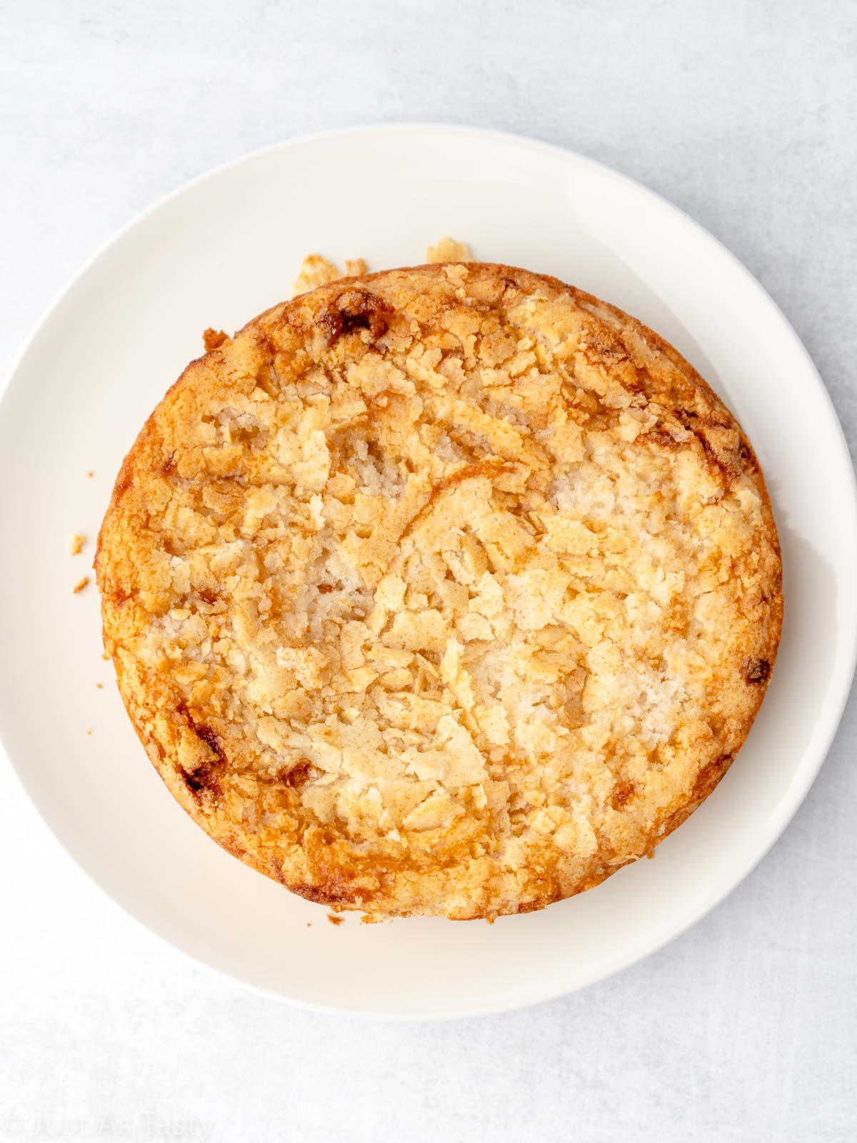 Round cake on a white plate. 