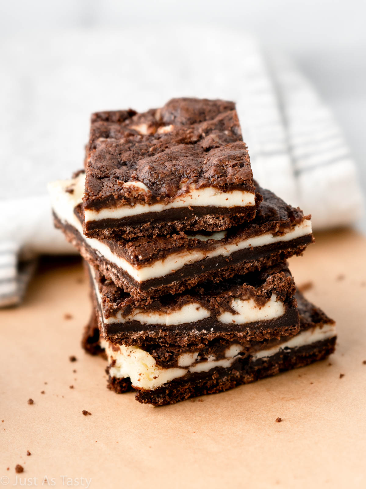 Stack of marbled cheesecake brownies.