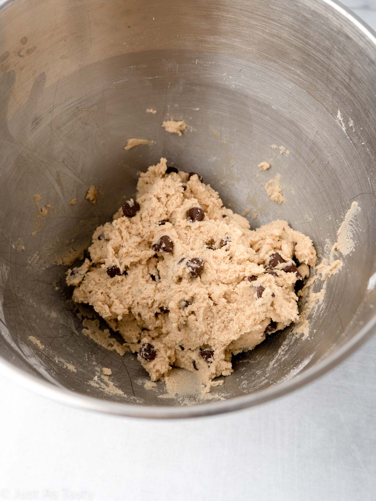 Chocolate chip cookie dough in a bowl.