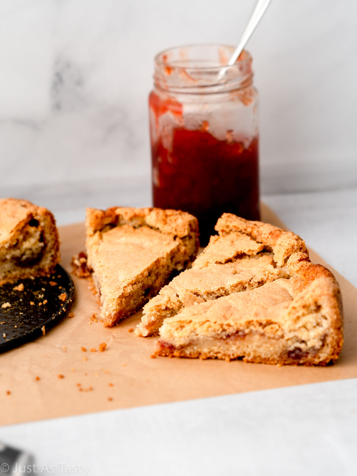 Three slices of strawberry jam cake.