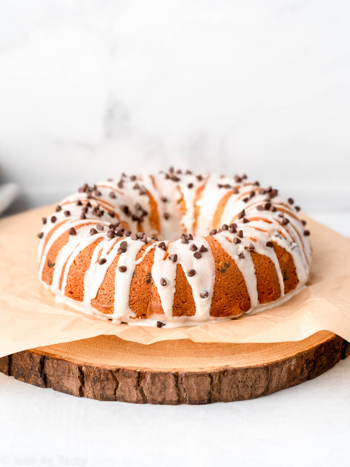 Chocolate chip bundt cake on brown parchment.