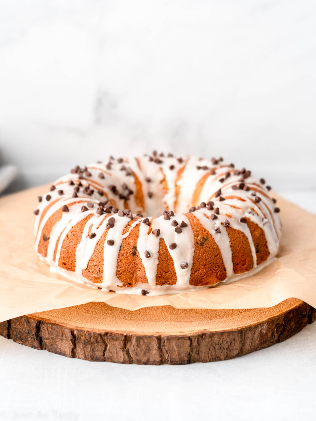 Chocolate chip bundt cake on brown parchment. 