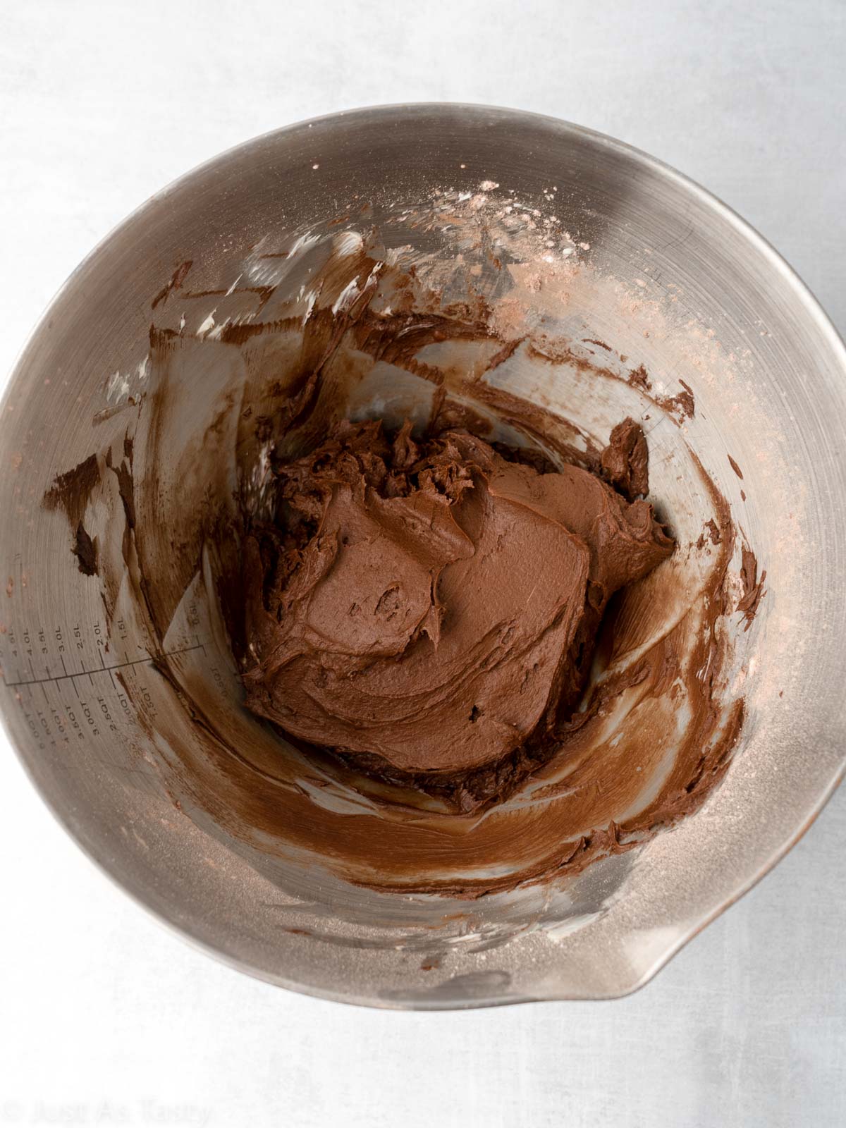 Chocolate frosting in a bowl.