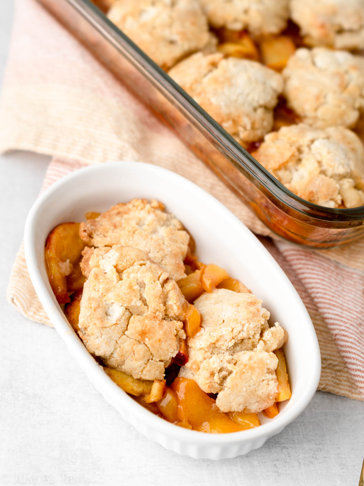 Peach cobbler in a bowl.