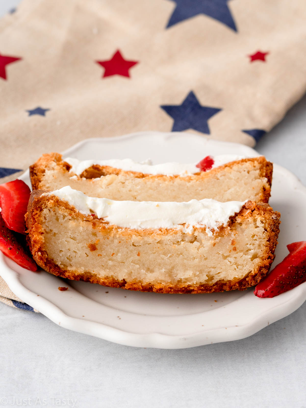 Two slices of gluten free pound cake on a plate.