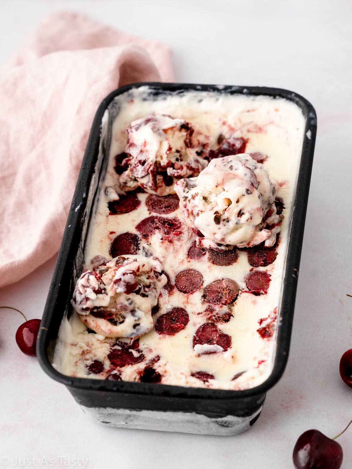 Black forest ice cream in a loaf pan.