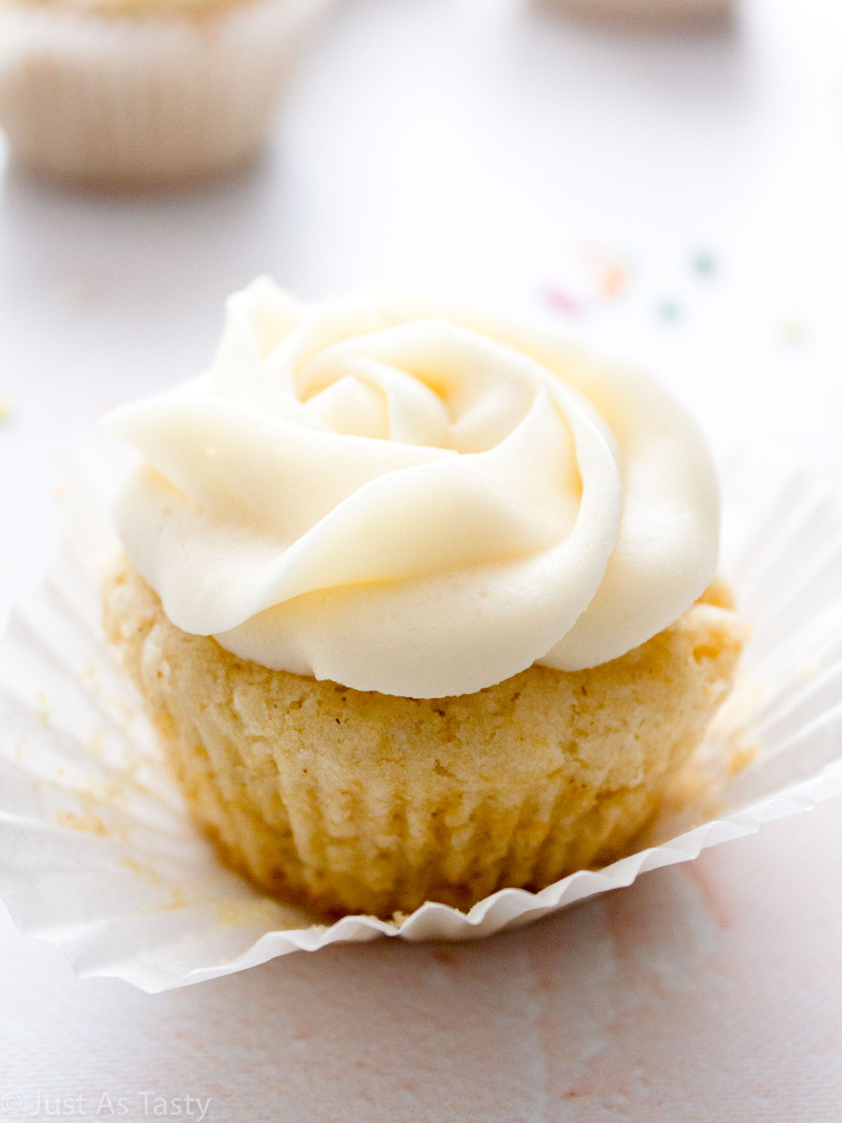 Close-up of a frosted vanilla cupcake.