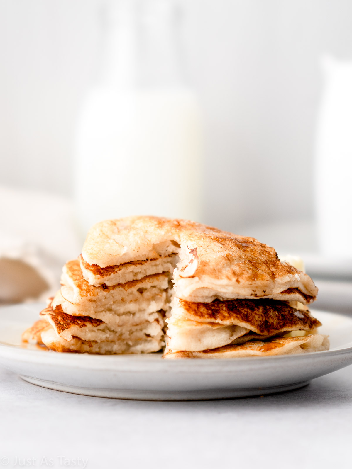 Stack of pancakes that have been cut into.