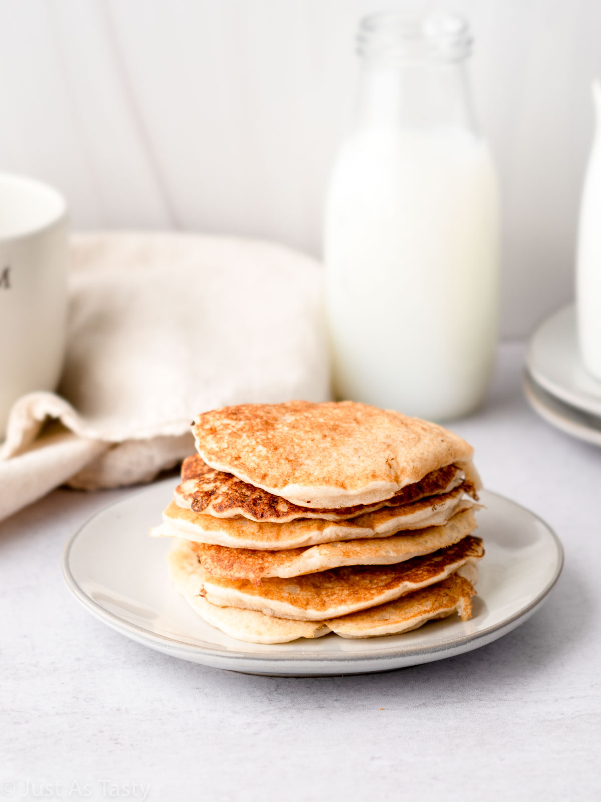 Stack of pancakes on a plate.