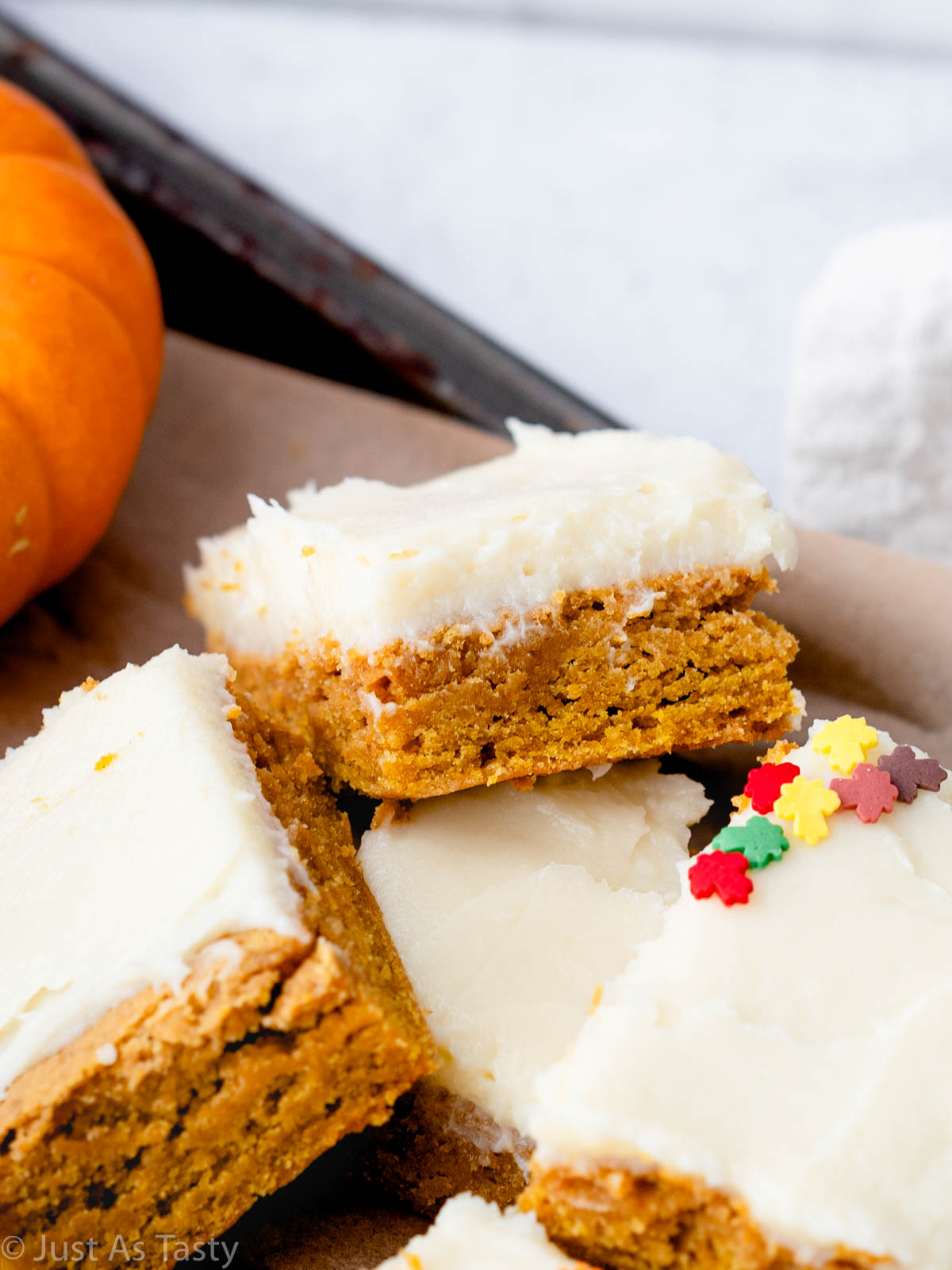 Close-up of gluten free pumpkin bars with cream cheese frosting.