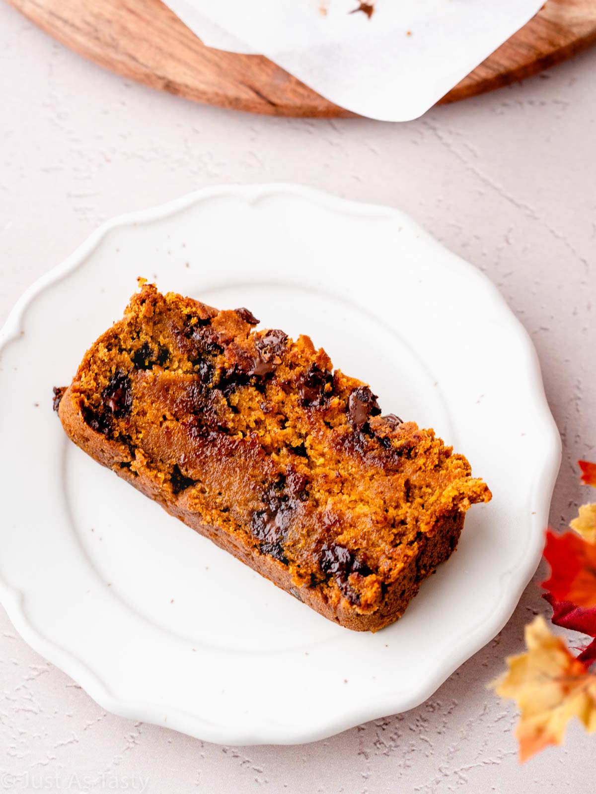 Slice of chocolate chip pumpkin bread on a plate.