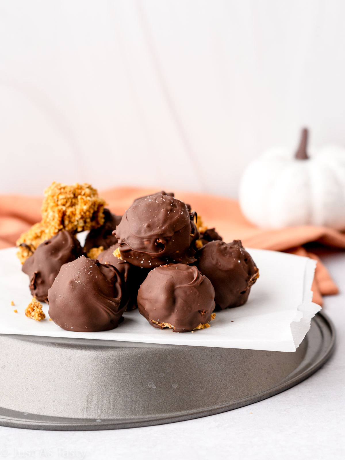 No bake pumpkin pie truffles on parchment. 