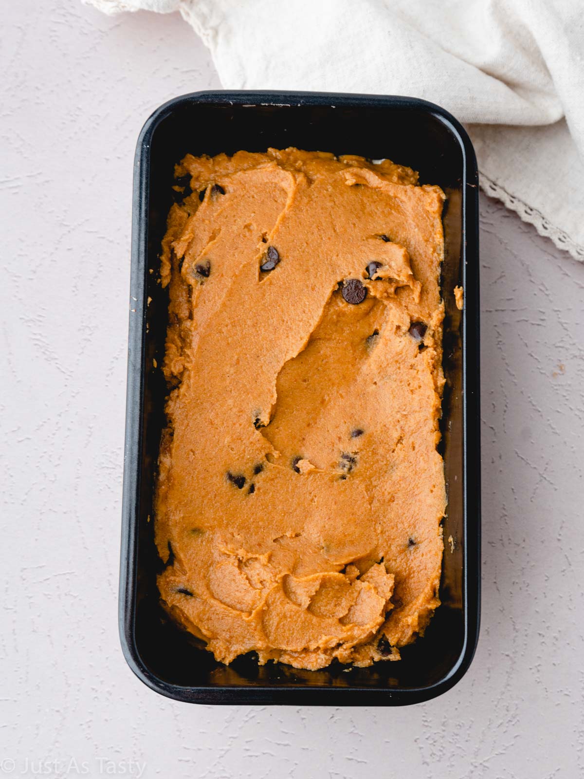 Pumpkin bread batter in a loaf pan.