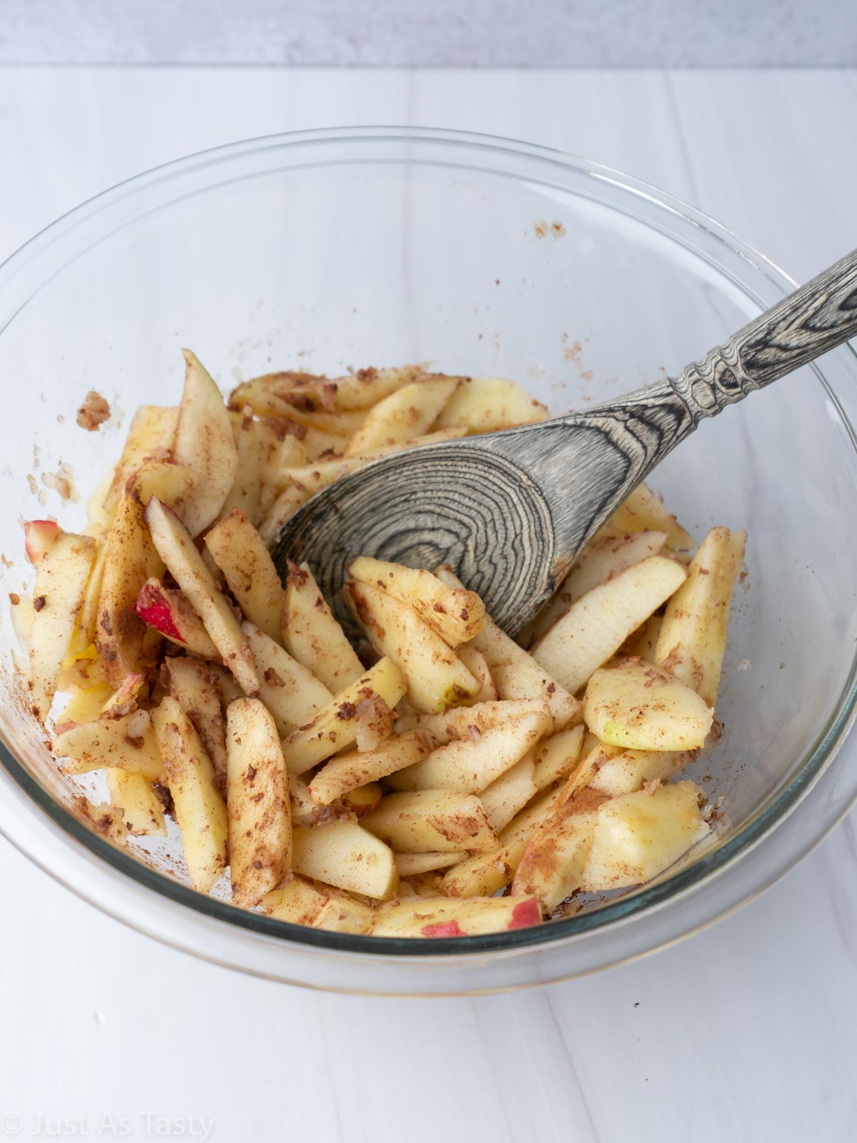 Sliced apples tossed with maple syrup and cinnamon.