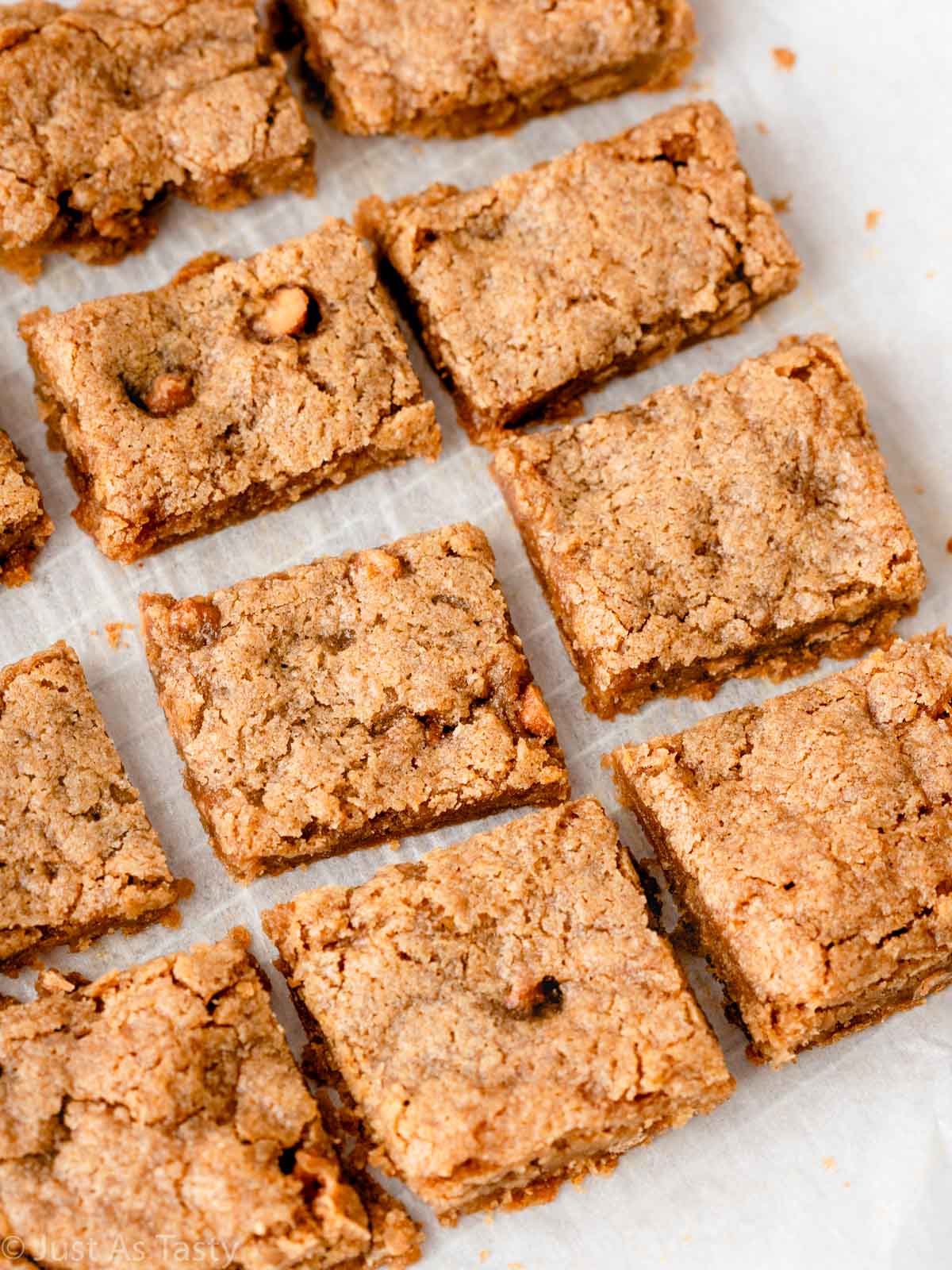 Apple blondies on parchment paper.