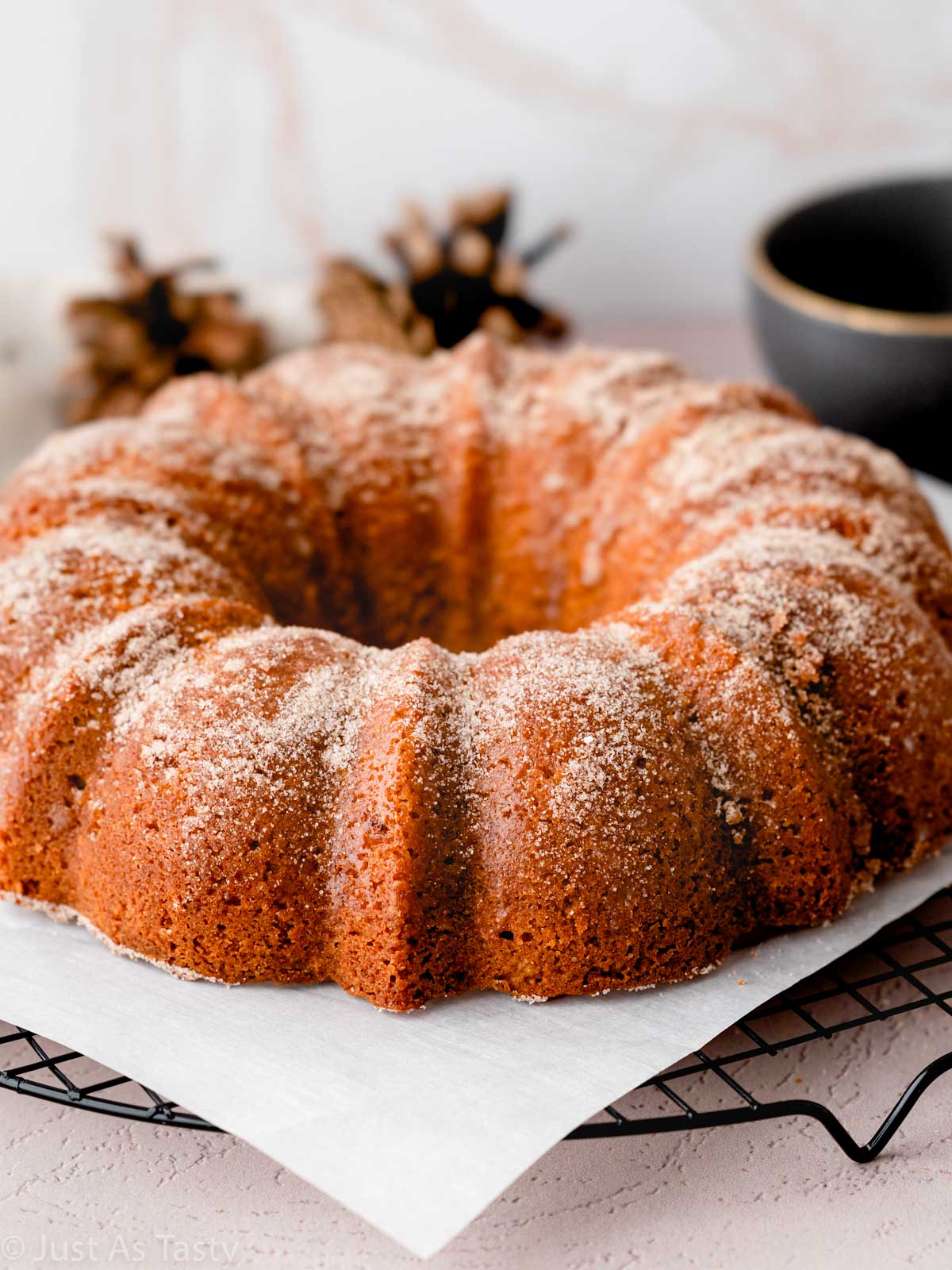 Apple cider bundt cake on parchment. 