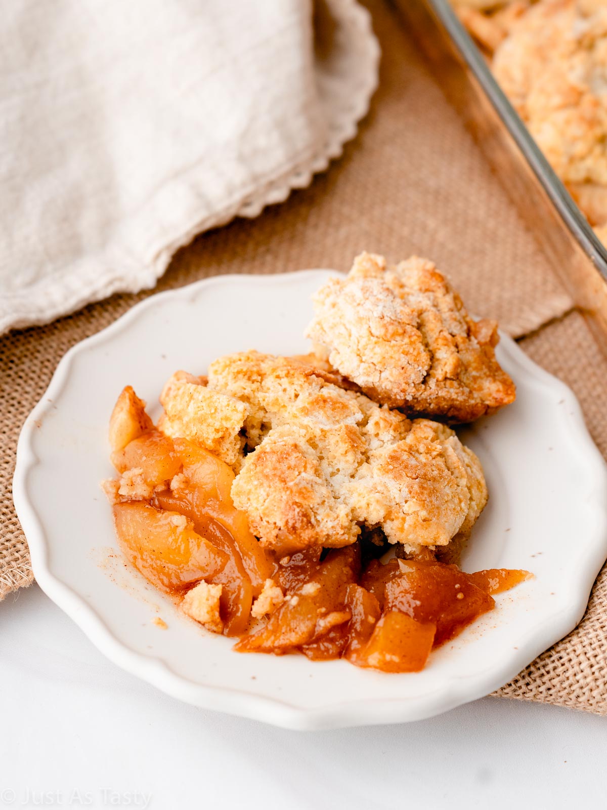 Serving of apple cobbler on a plate.