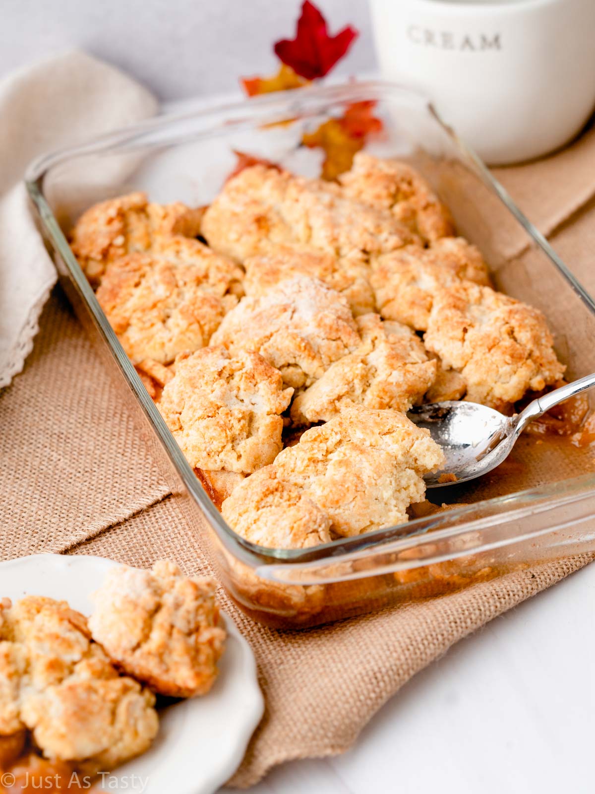 Gluten free apple cobbler in a glass dish.