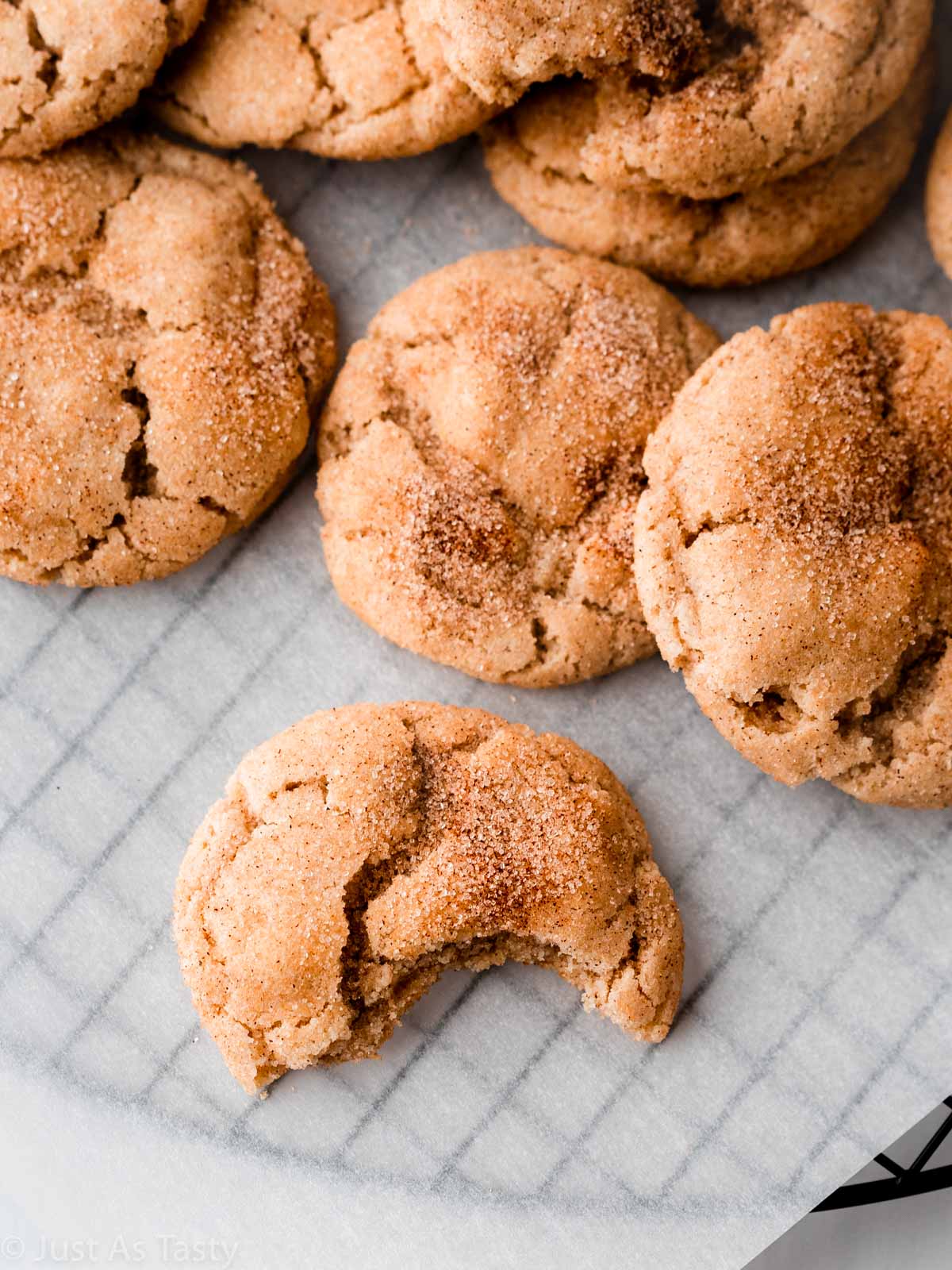 Snickerdoodle cookie with a bite taken out of it. 