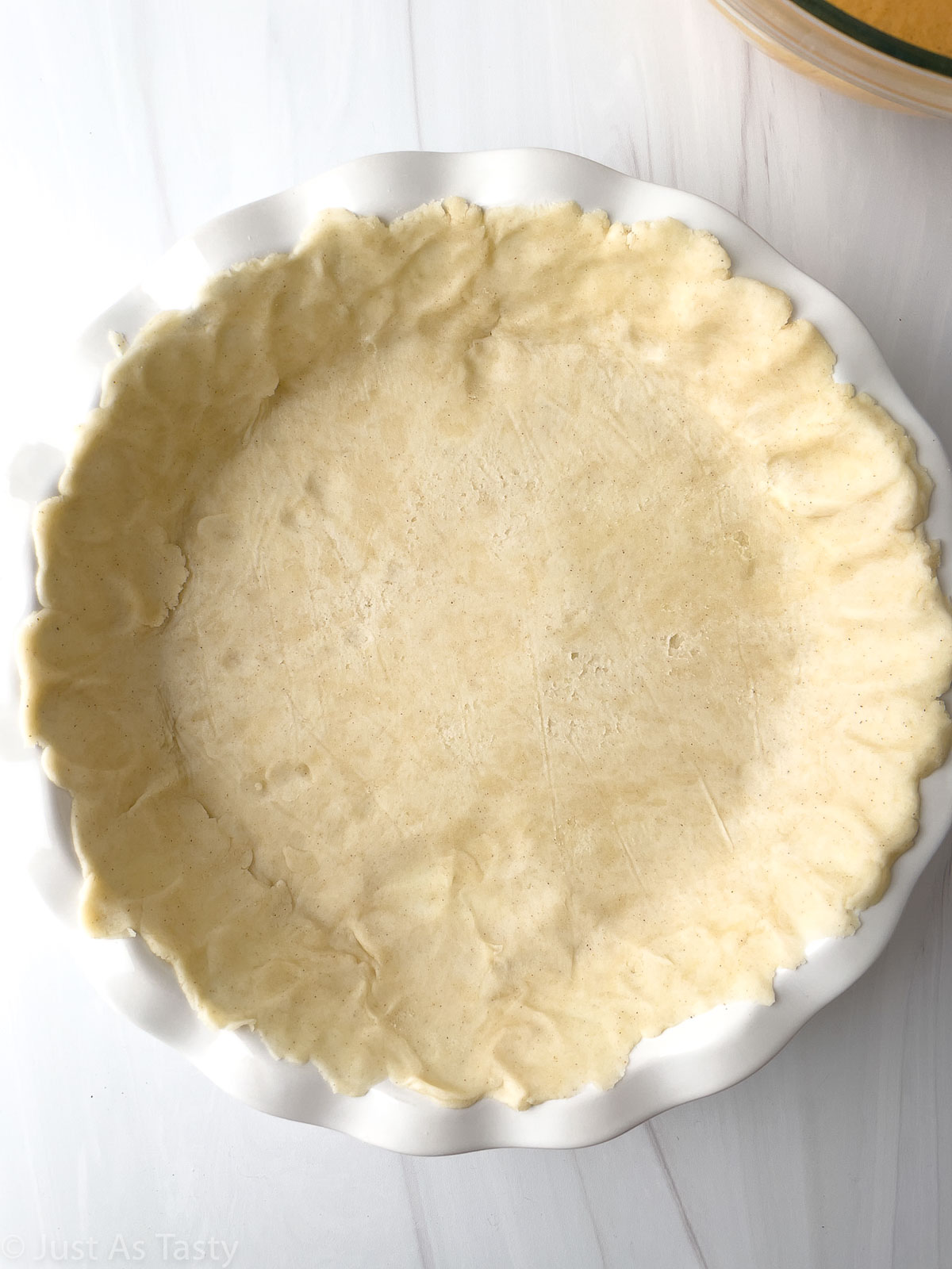 Pie crust dough in a pie plate. 