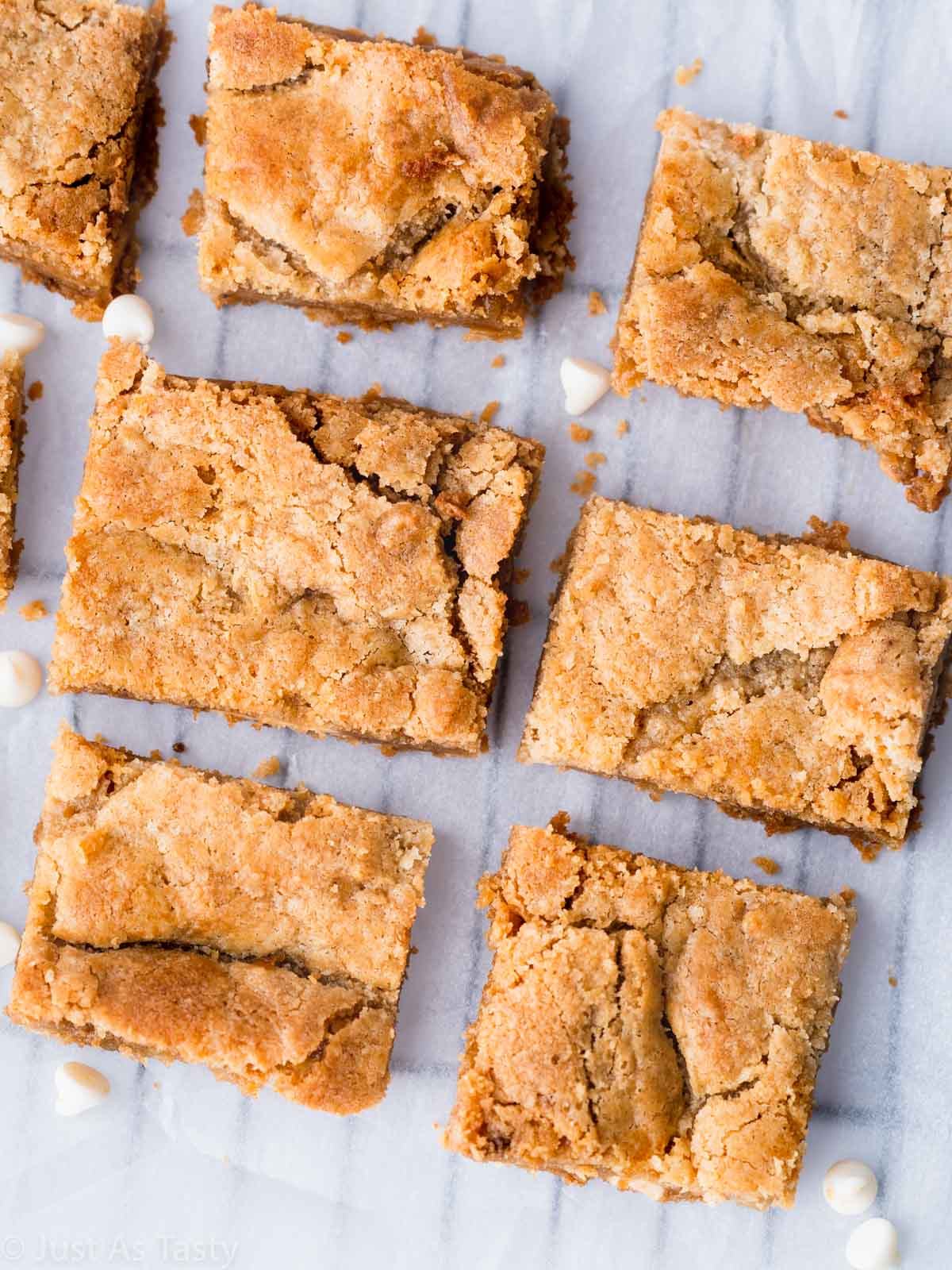 White chocolate brownies on parchment paper.