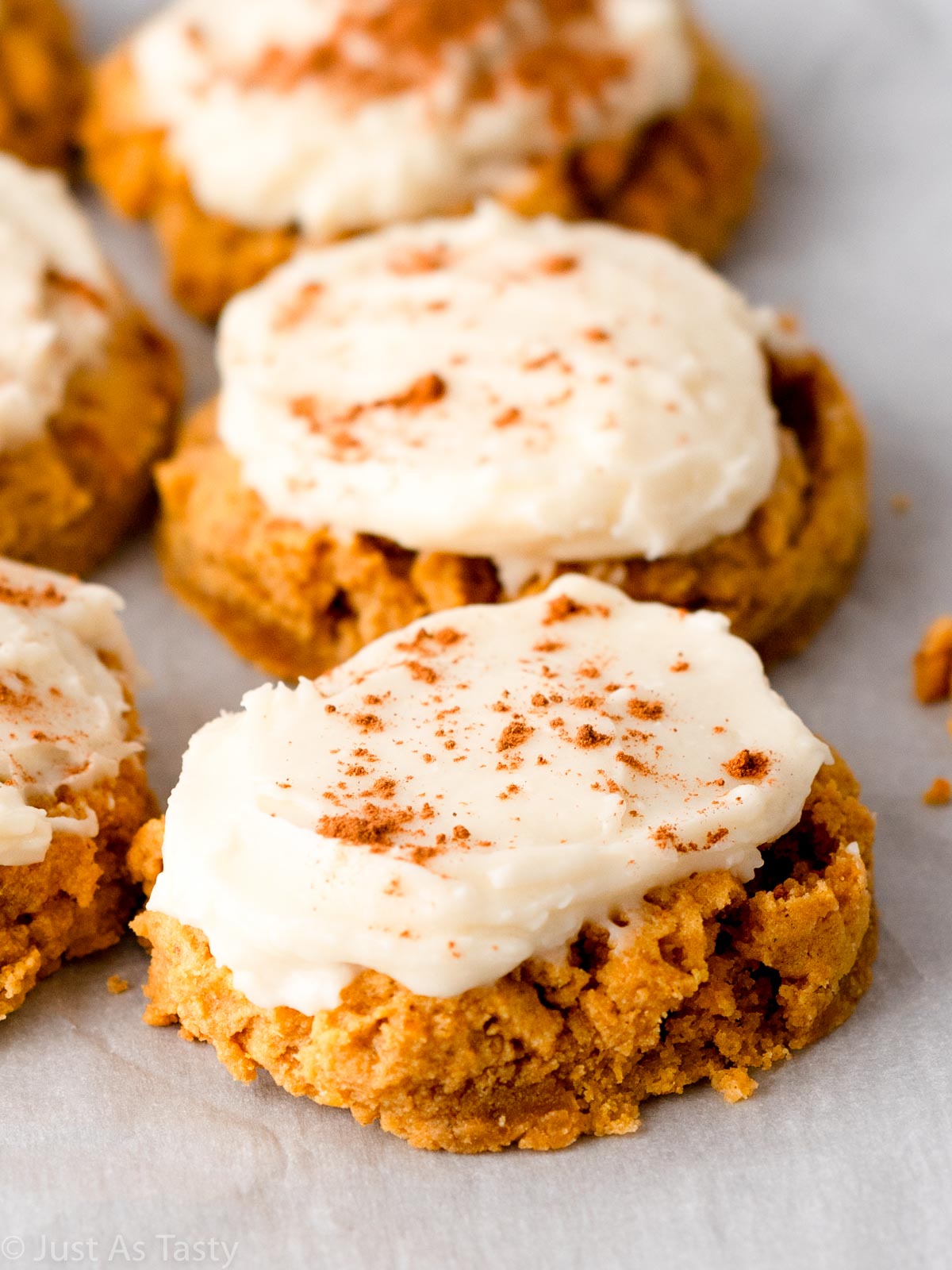 Close-up of a frosted gluten free pumpkin cookie. 