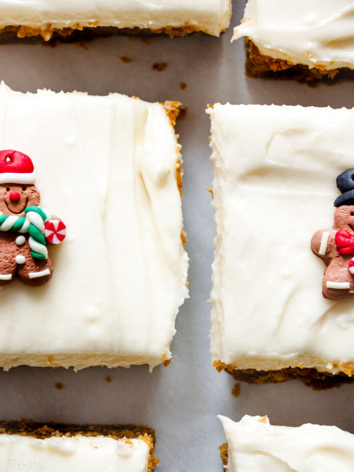 Close-up of gingerbread bars topped with cream cheese frosting.