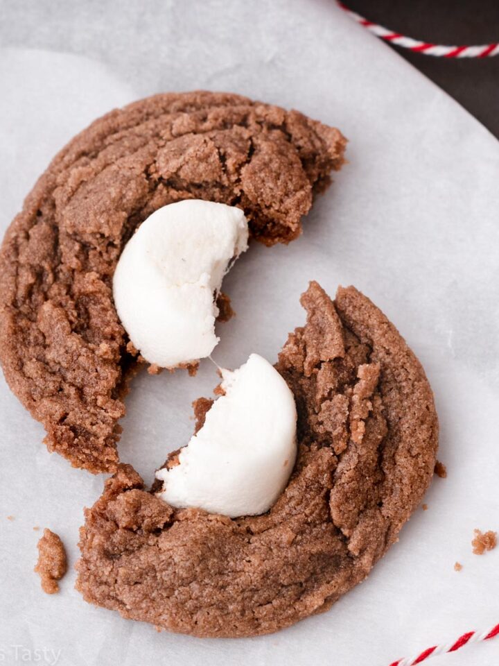 Close-up of a hot chocolate marshmallow cookie broken in half.